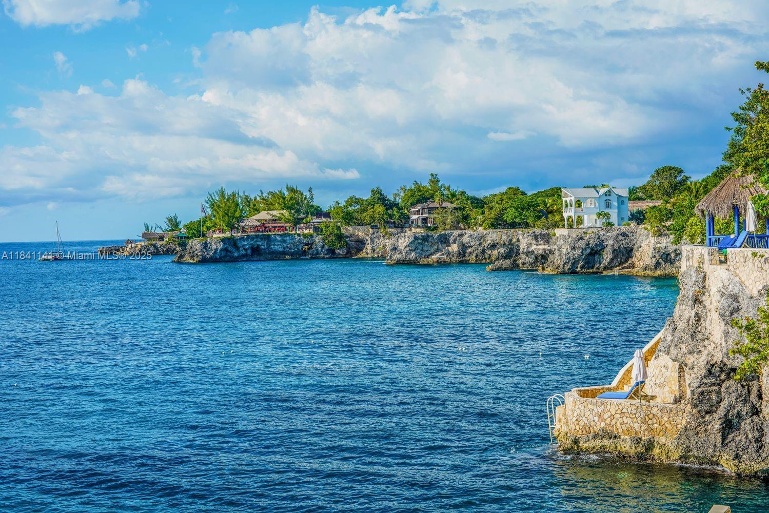 144 One Love Drive undefined, - 00000 - Photo 30 of 34 a view of a garden with lawn chairs
