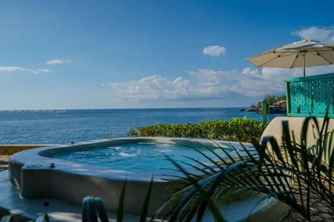 a view of a patio with table and chairs with wooden floor