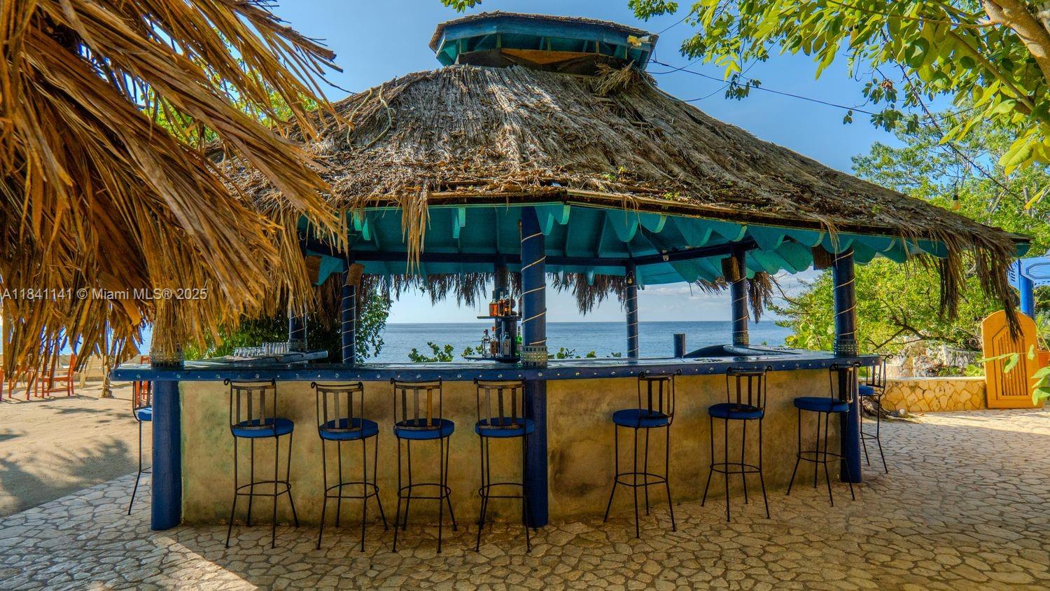 144 One Love Drive undefined, - 00000 - Photo 32 of 34 a view of a patio with table and chairs with wooden floor