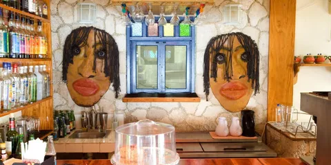 a bed room with a bed and a large window