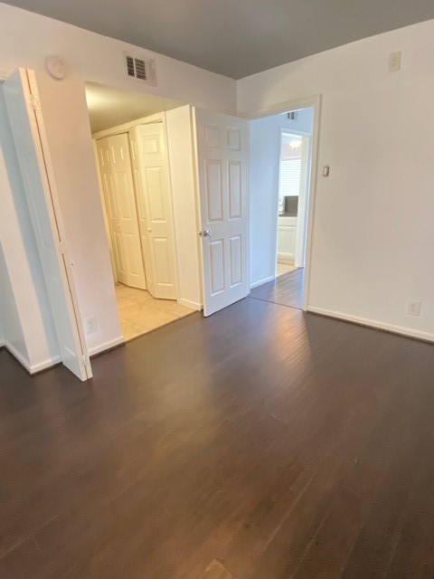 4701 Bell Street, Unit 10 Houston, TX 77023 - Photo 14 of 19 a view of empty room with wooden floor
