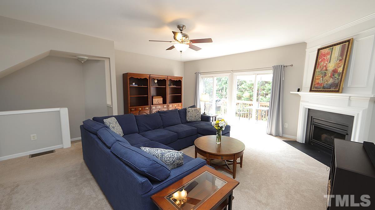 7225 Galon Glen Road Raleigh, NC 27613 - Photo 11 of 20 a living room with furniture and a fireplace