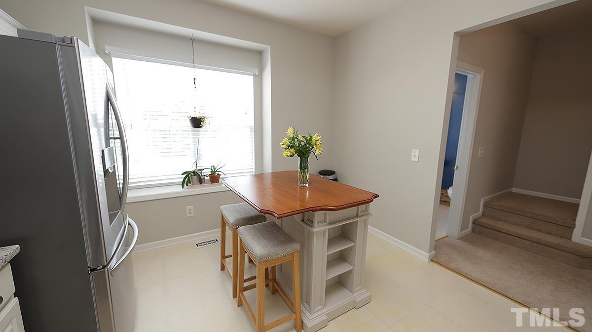 7225 Galon Glen Road Raleigh, NC 27613 - Photo 8 of 20 a dining room with furniture and window
