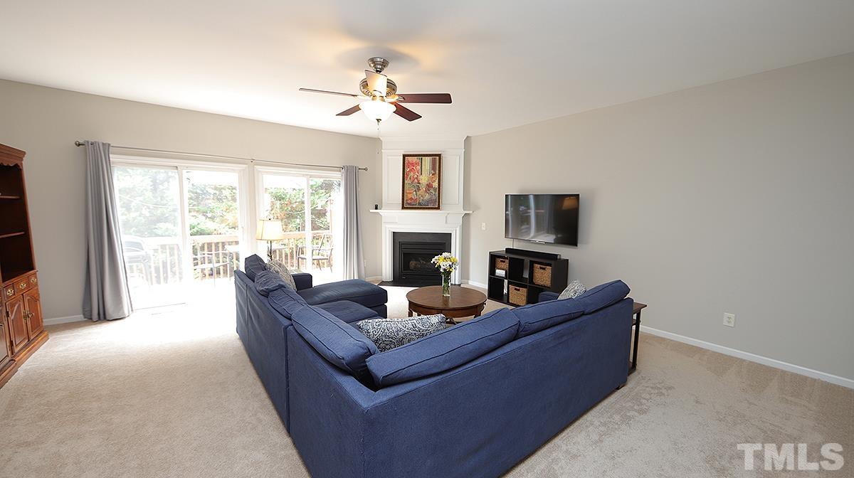 7225 Galon Glen Road Raleigh, NC 27613 - Photo 9 of 20 a living room with furniture and a fireplace
