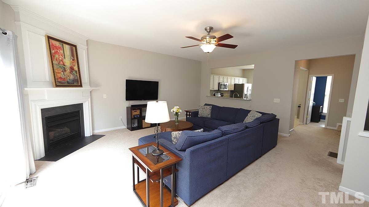 7225 Galon Glen Road Raleigh, NC 27613 - Photo 10 of 20 a living room with furniture and a flat screen tv