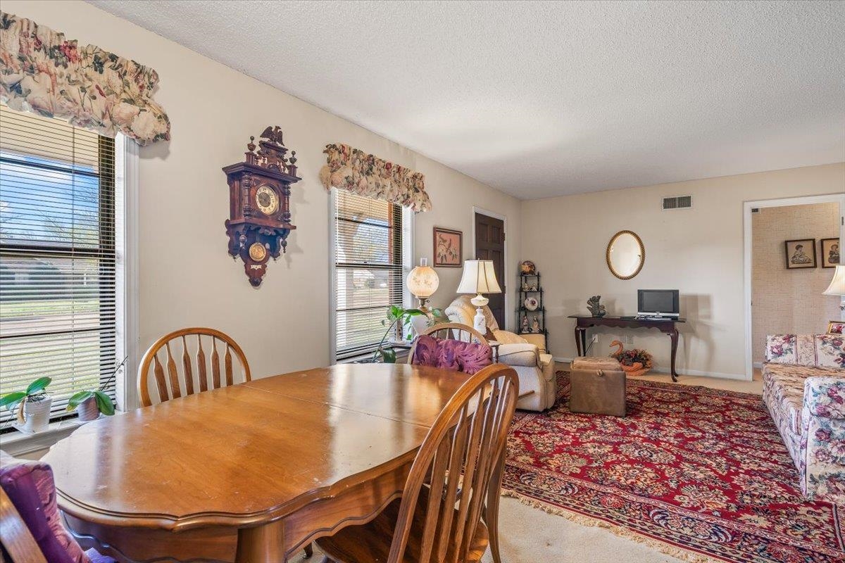6824 Dawnhill Road Bartlett, TN 38135 - Photo 4 of 31 a view of a dining room with furniture and wooden floor