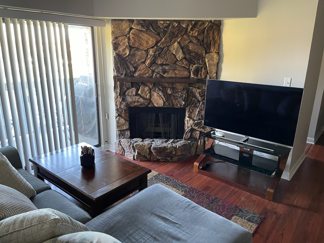 525 Cumnor Road, Unit 302 Westmont, IL 60559 - Photo 2 of 12 a living room with furniture and a fireplace