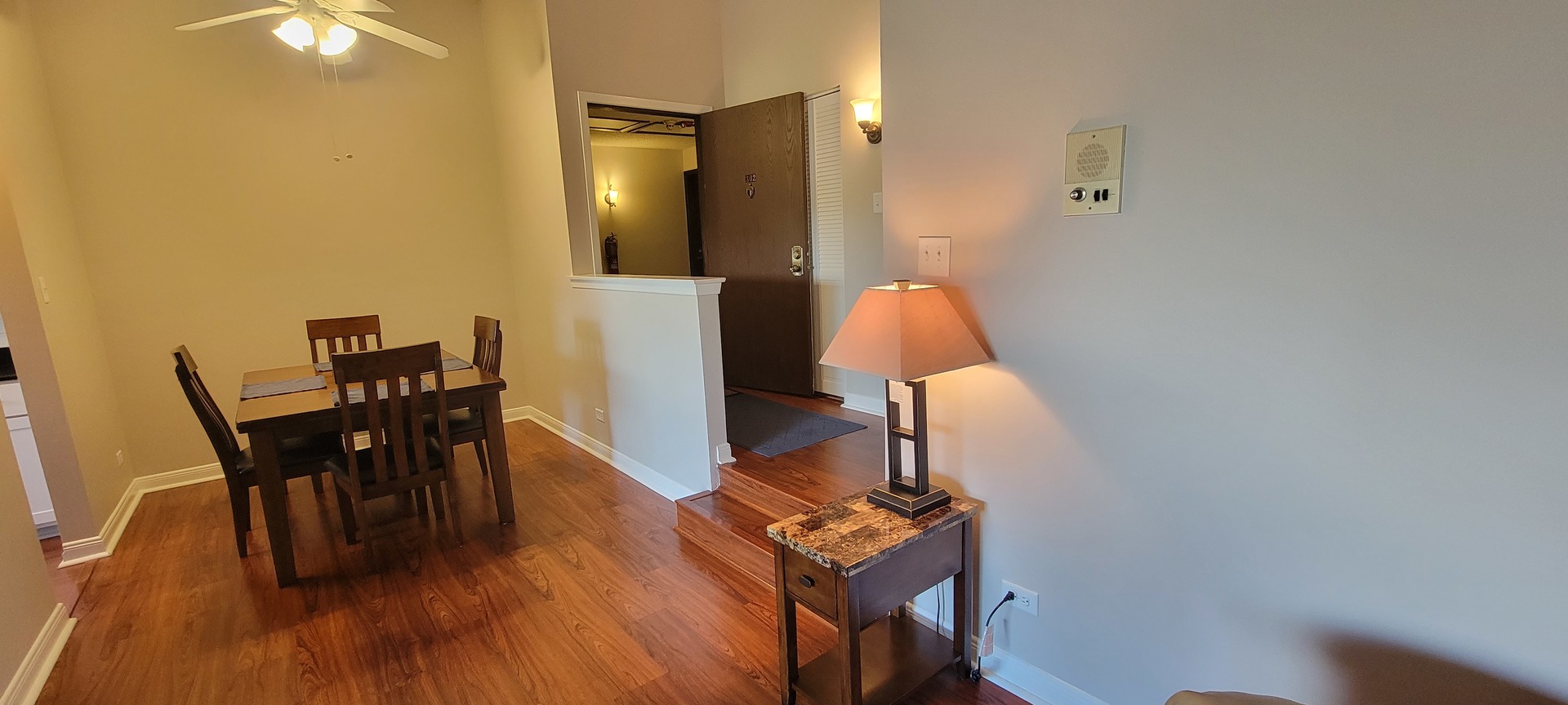 525 Cumnor Road, Unit 302 Westmont, IL 60559 - Photo 3 of 12 a view of a workspace with furniture and wooden floor