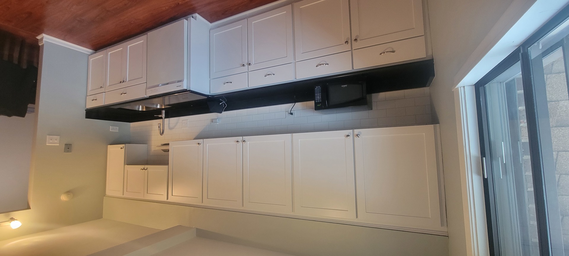 525 Cumnor Road, Unit 302 Westmont, IL 60559 - Photo 4 of 12 a kitchen with white cabinets and sink
