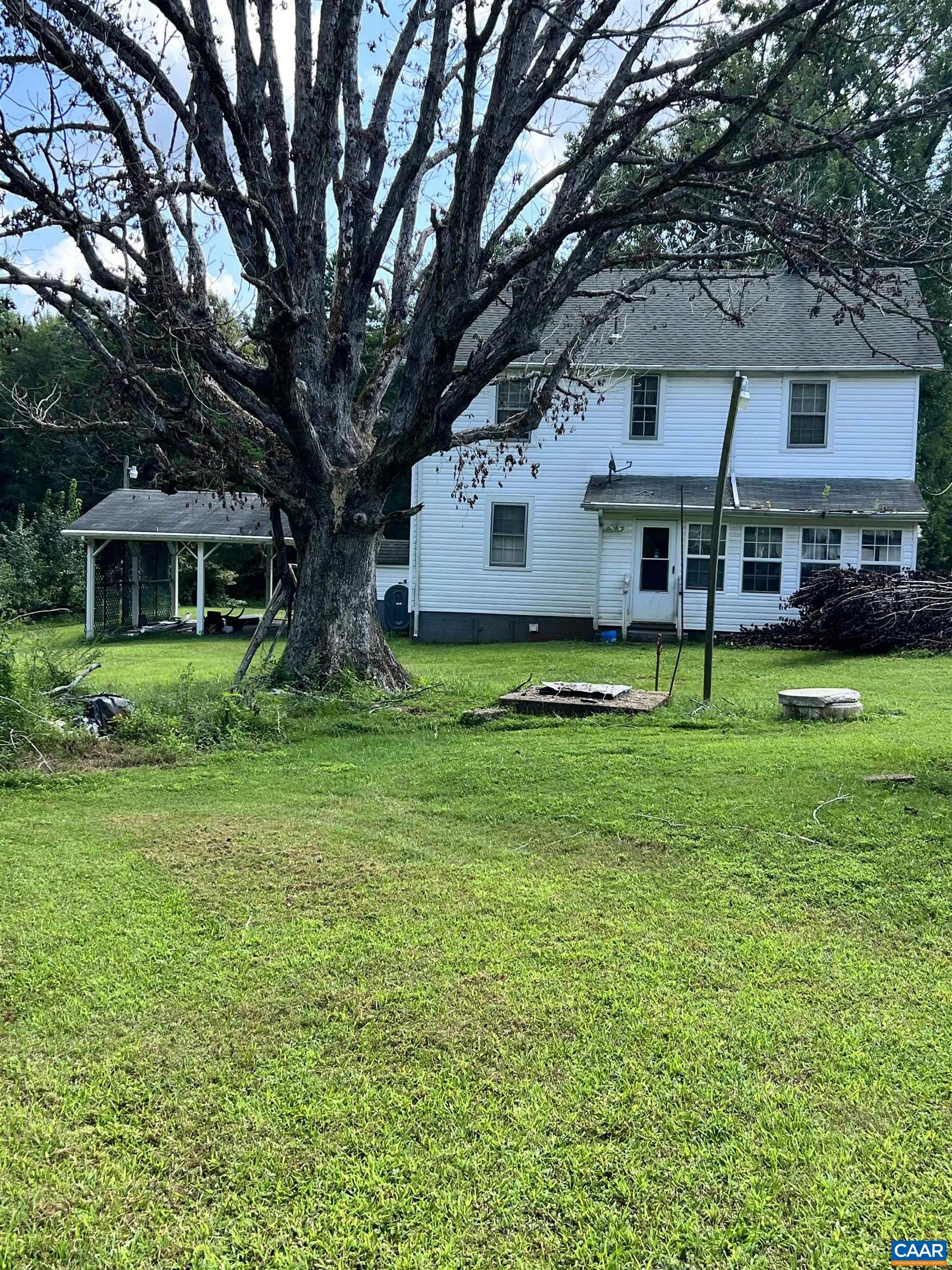 2857 Cedar Lane Road Kents Store, VA 23084 - Photo 11 of 36 a view of house with garden and tall trees