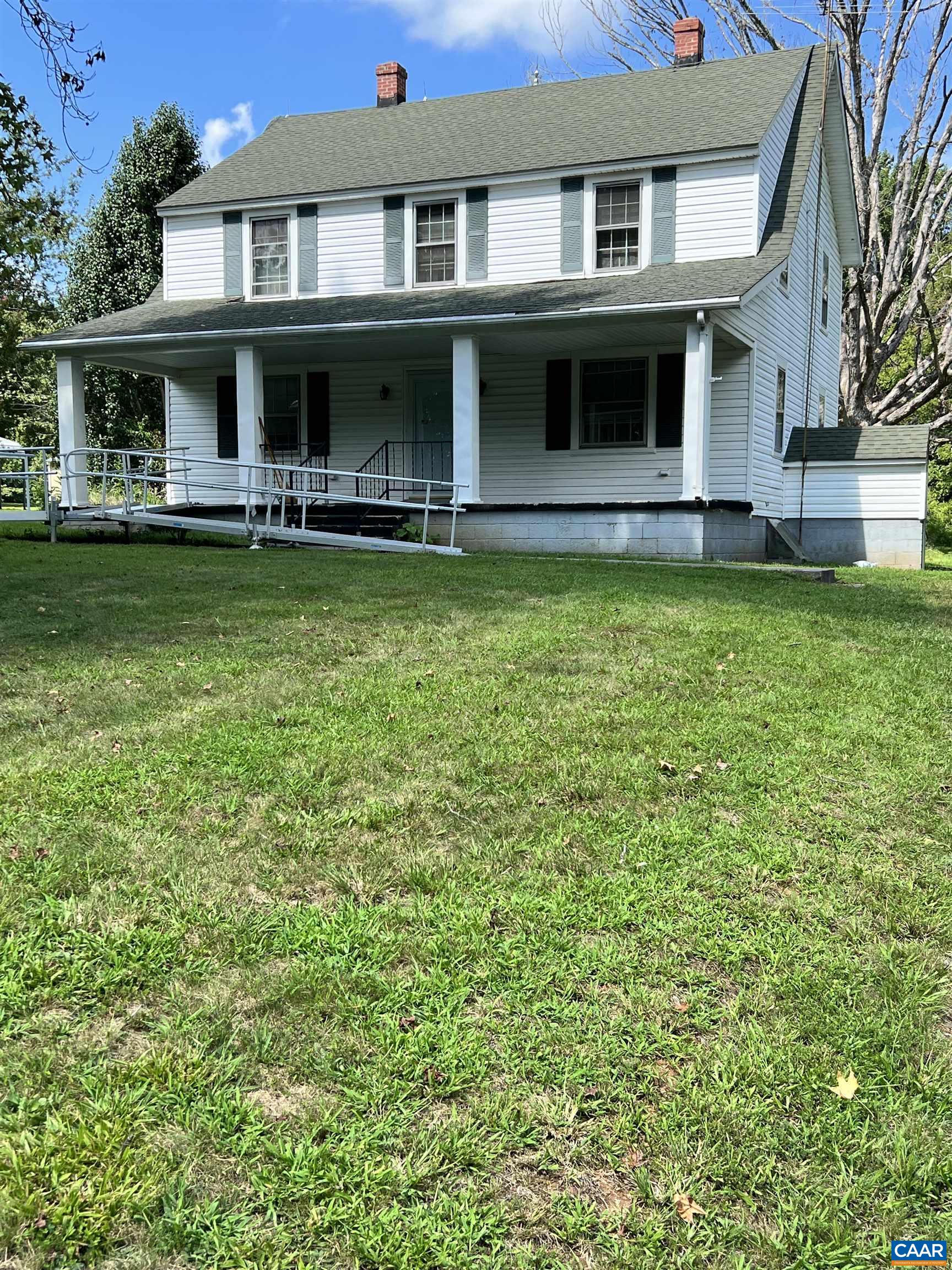 2857 Cedar Lane Road Kents Store, VA 23084 - Photo 2 of 36 a front view of a house with garden