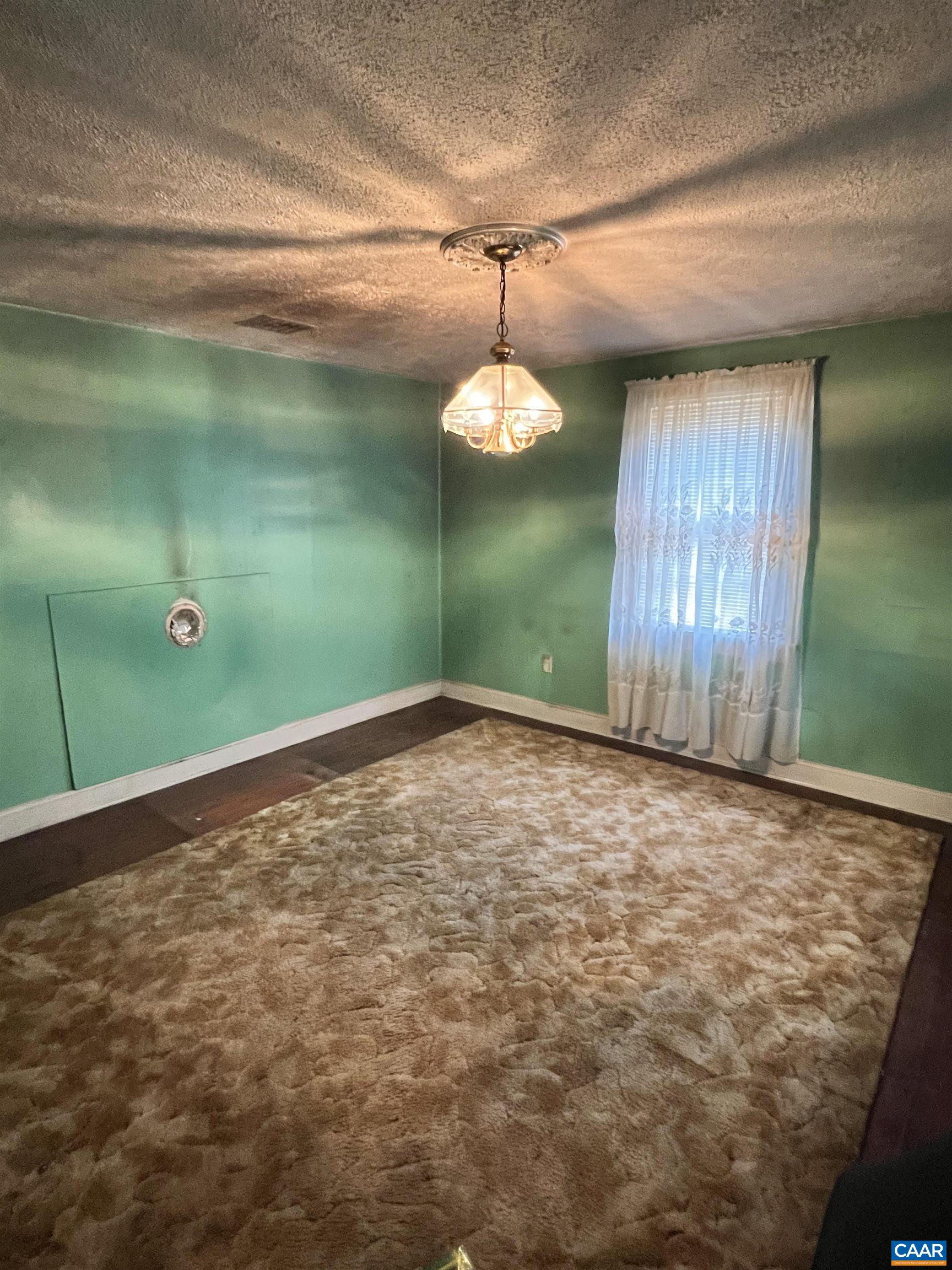 2857 Cedar Lane Road Kents Store, VA 23084 - Photo 26 of 36 a view of a room with a chandelier fan and windows