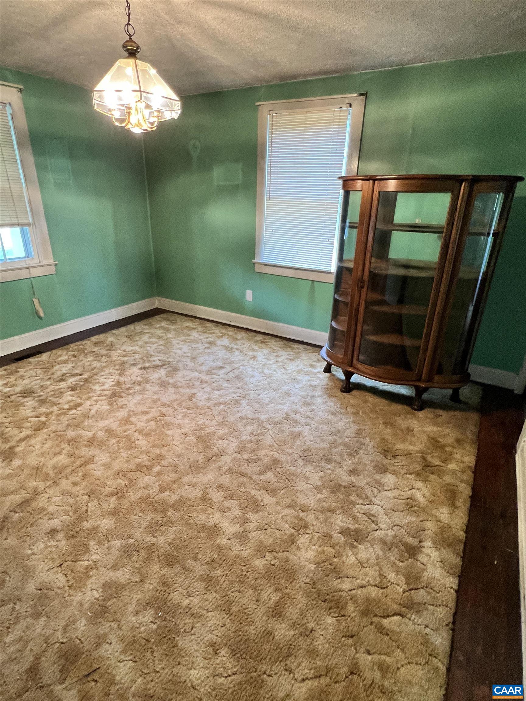 2857 Cedar Lane Road Kents Store, VA 23084 - Photo 27 of 36 a room with window and a chandelier
