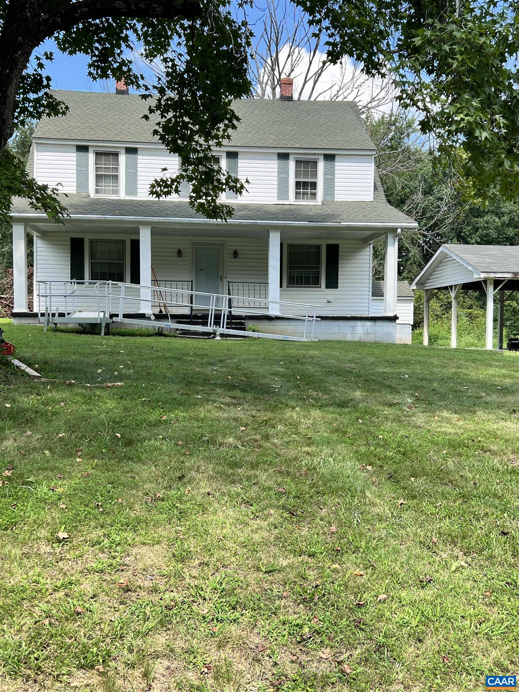 2857 Cedar Lane Road Kents Store, VA 23084 - Photo 3 of 36 a front view of a house with a garden