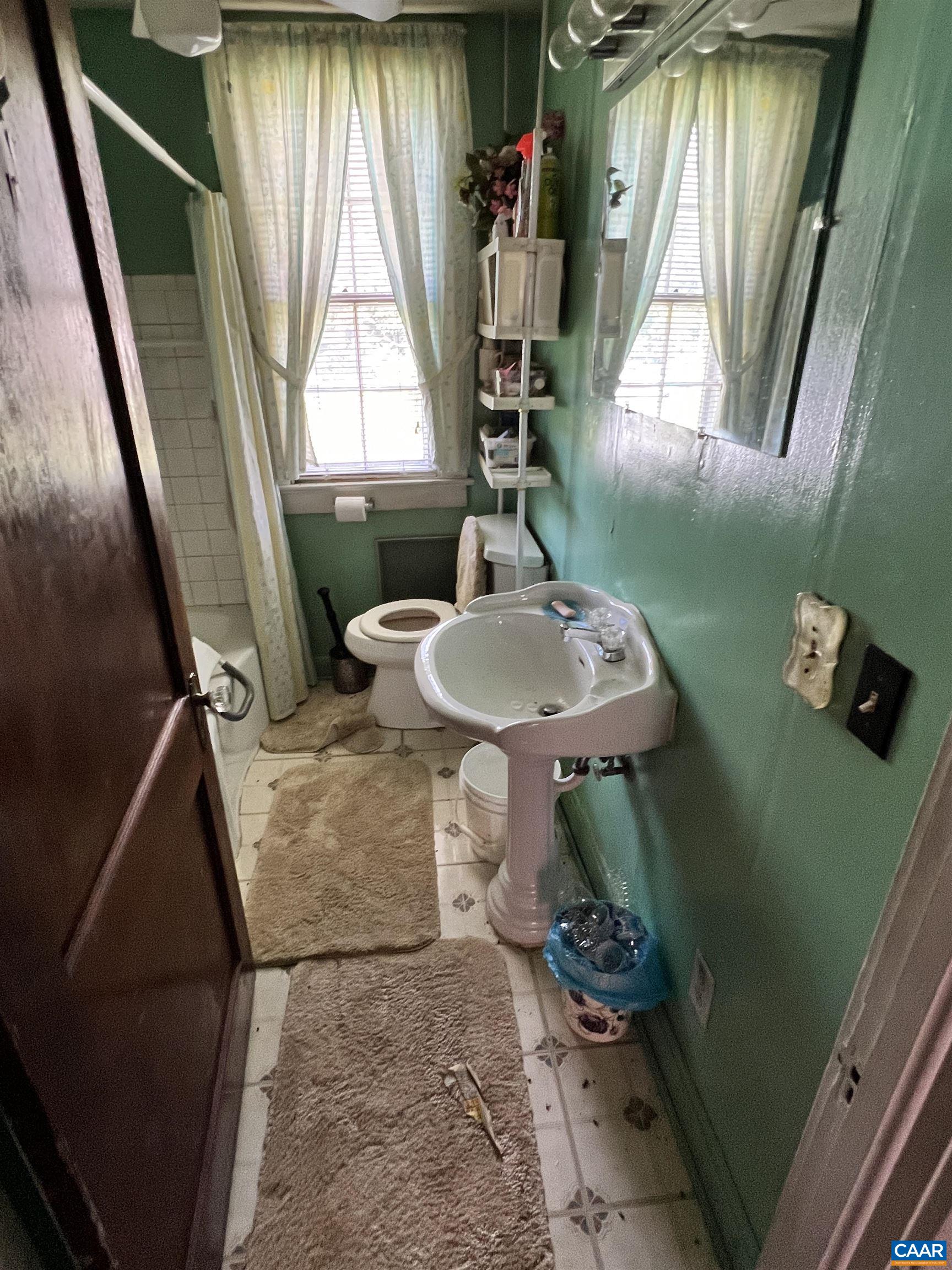 2857 Cedar Lane Road Kents Store, VA 23084 - Photo 35 of 36 a bathroom with a sink toilet and mirror