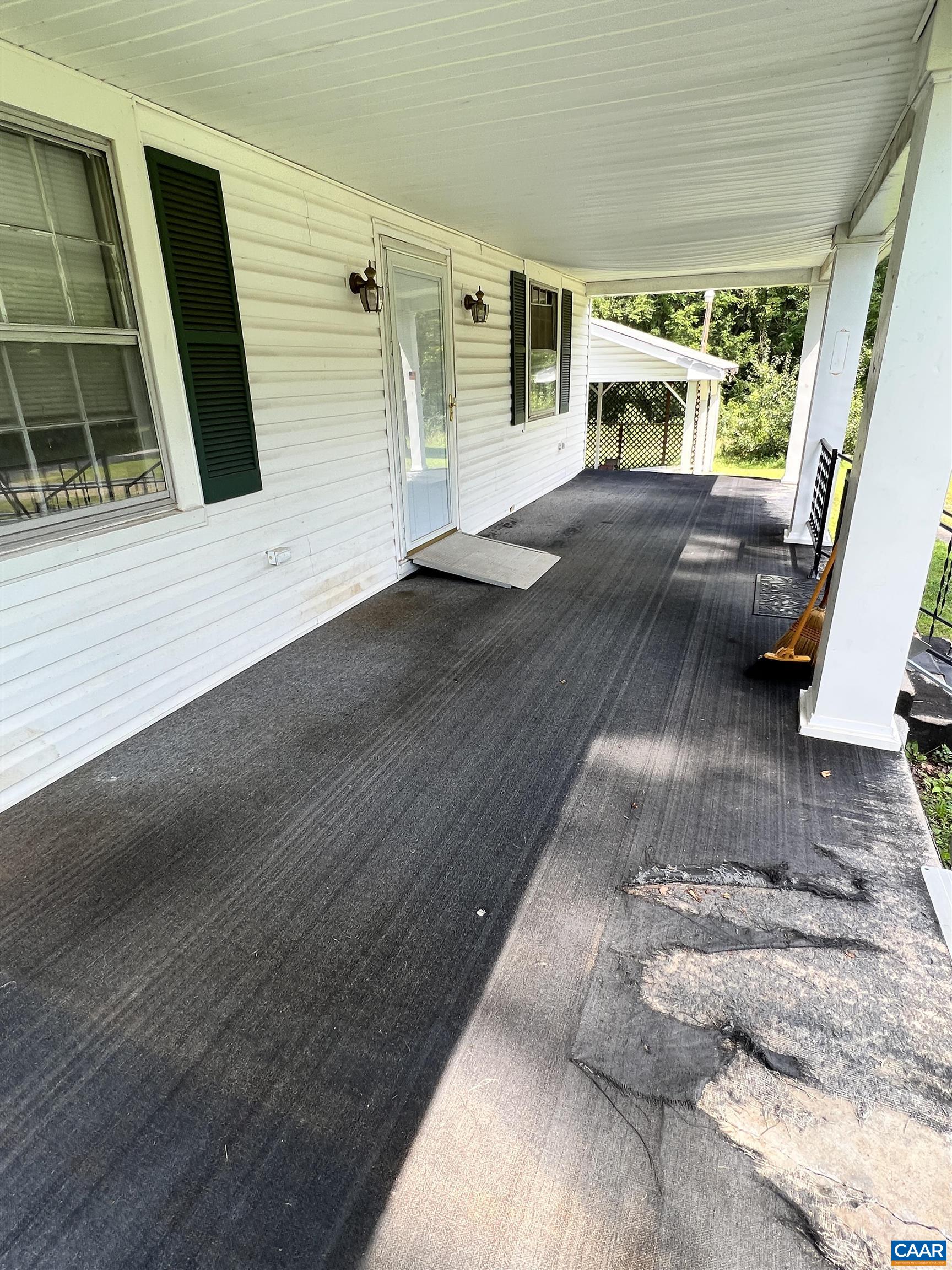 2857 Cedar Lane Road Kents Store, VA 23084 - Photo 4 of 36 a view of a porch with wooden floor and iron stairs