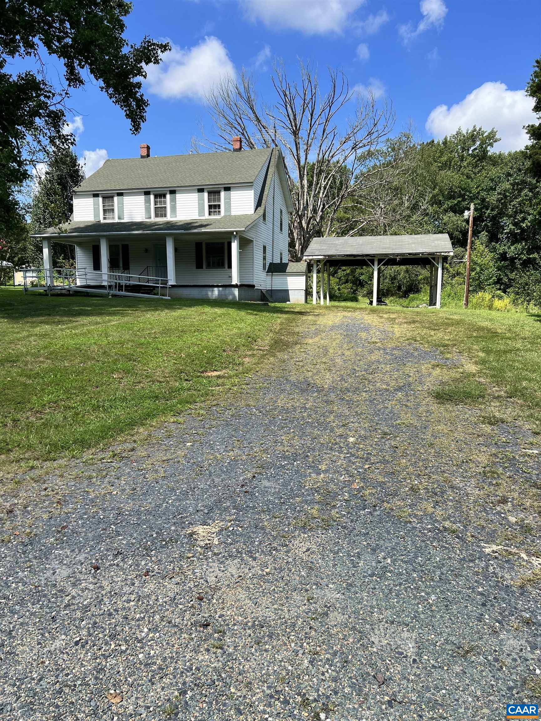 2857 Cedar Lane Road Kents Store, VA 23084 - Photo 8 of 36 a front view of a house with a garden