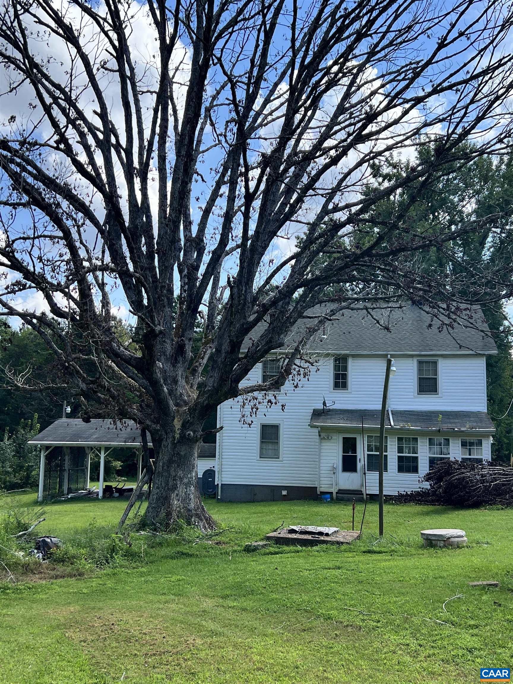 2857 Cedar Lane Road Kents Store, VA 23084 - Photo 10 of 36 a house that has a tree in front of a house