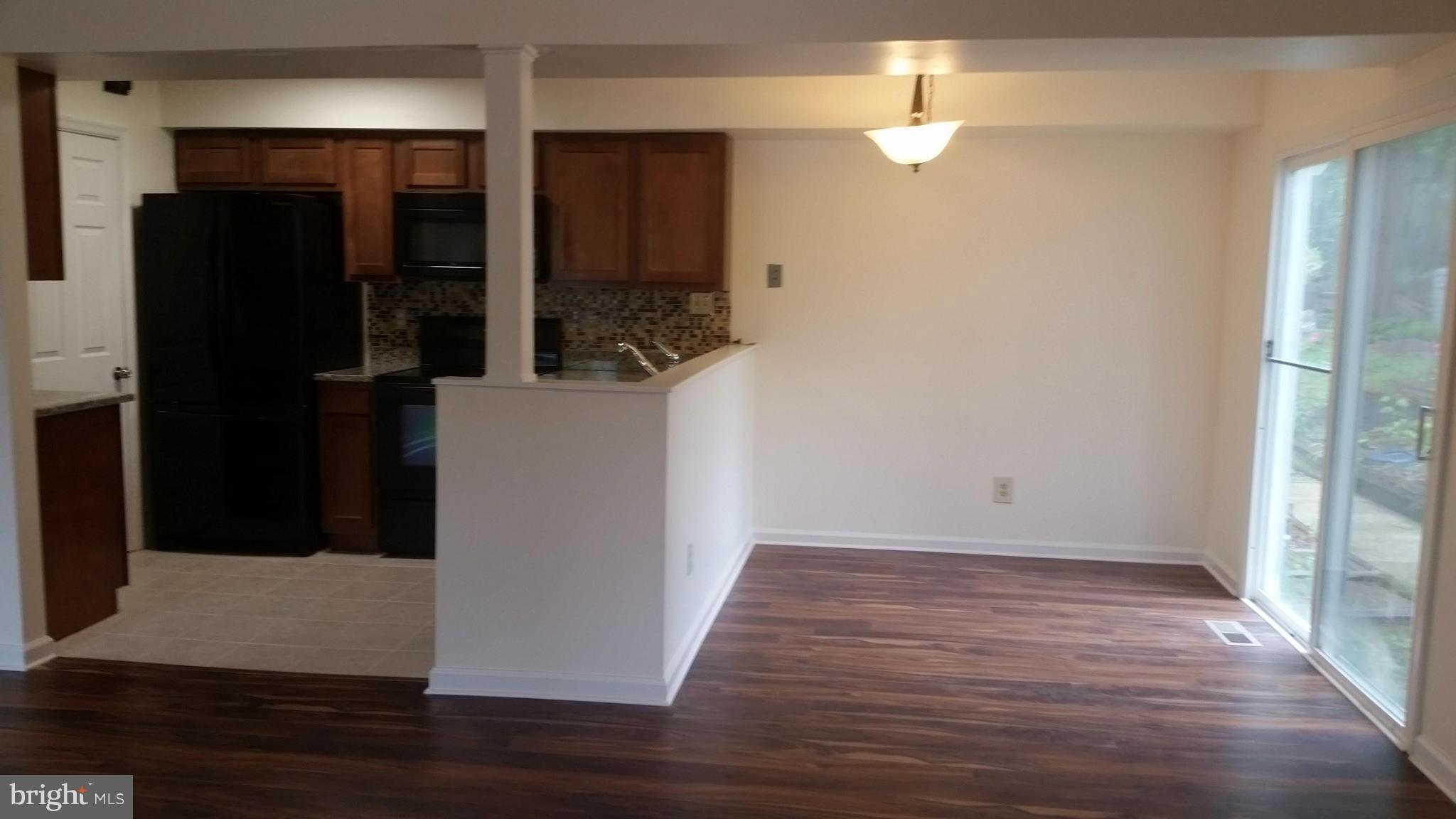 98 Ridgelawn Road, Unit A Reisterstown, MD 21136 - Photo 4 of 22 a view of hallway with wooden floor
