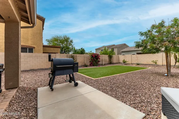 a swimming pool with outdoor seating and yard