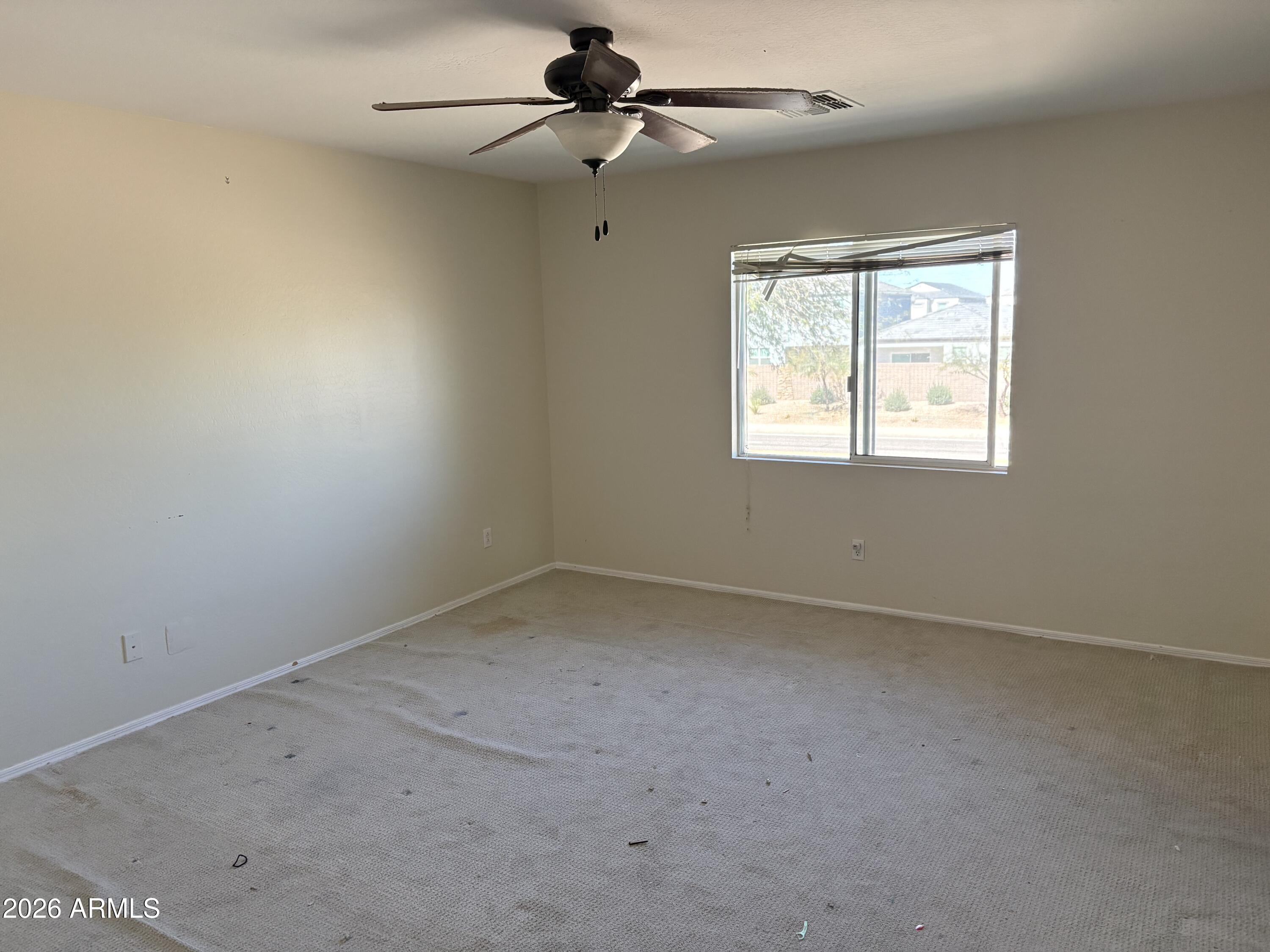 5222 East Silverbell Road San Tan Valley, AZ 85143 - Photo 13 of 16 an empty room with a window