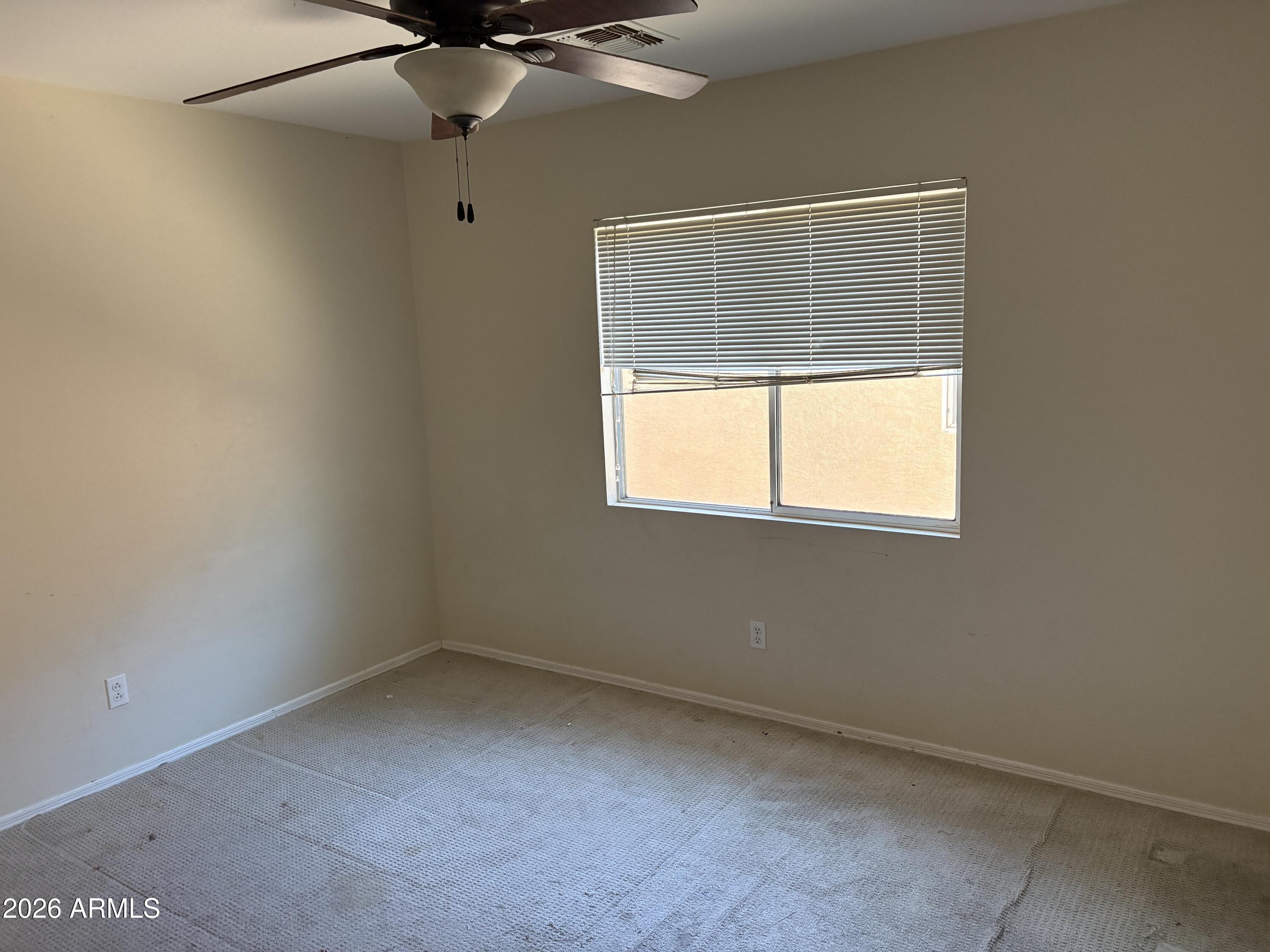 5222 East Silverbell Road San Tan Valley, AZ 85143 - Photo 8 of 16 an empty room with a window