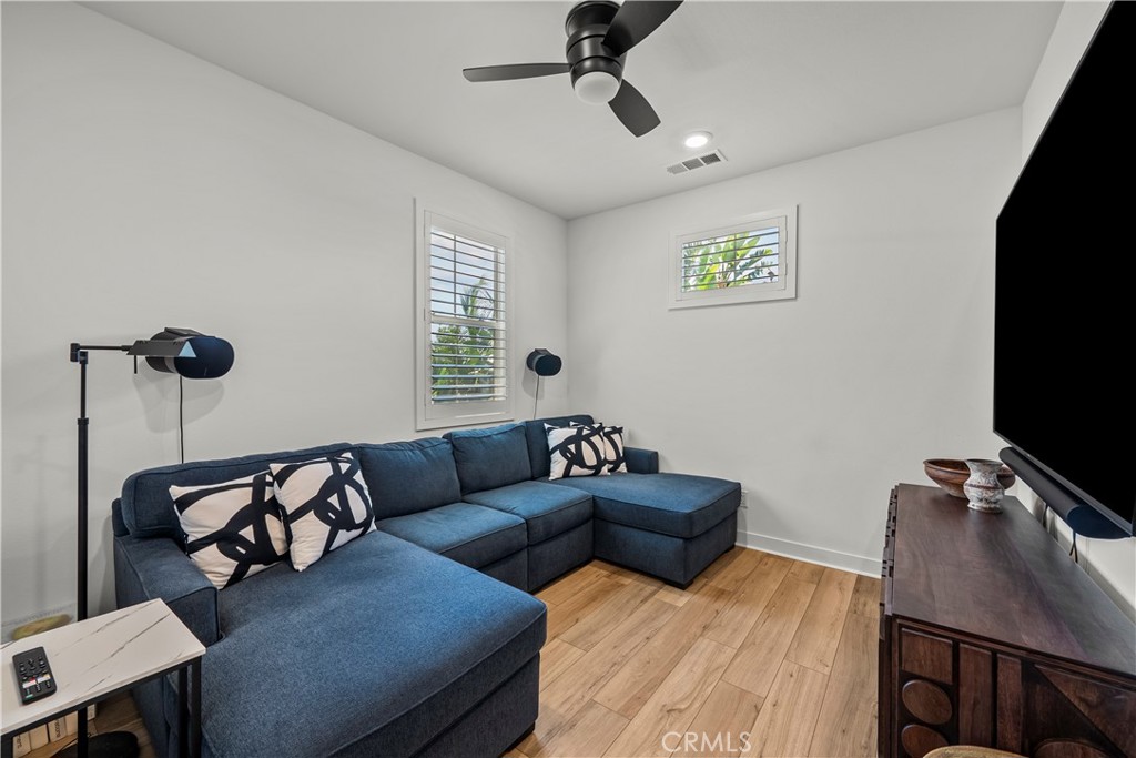 1663 Rosewell Road West Covina, CA 91791 - Photo 25 of 45 a living room with furniture and a flat screen tv