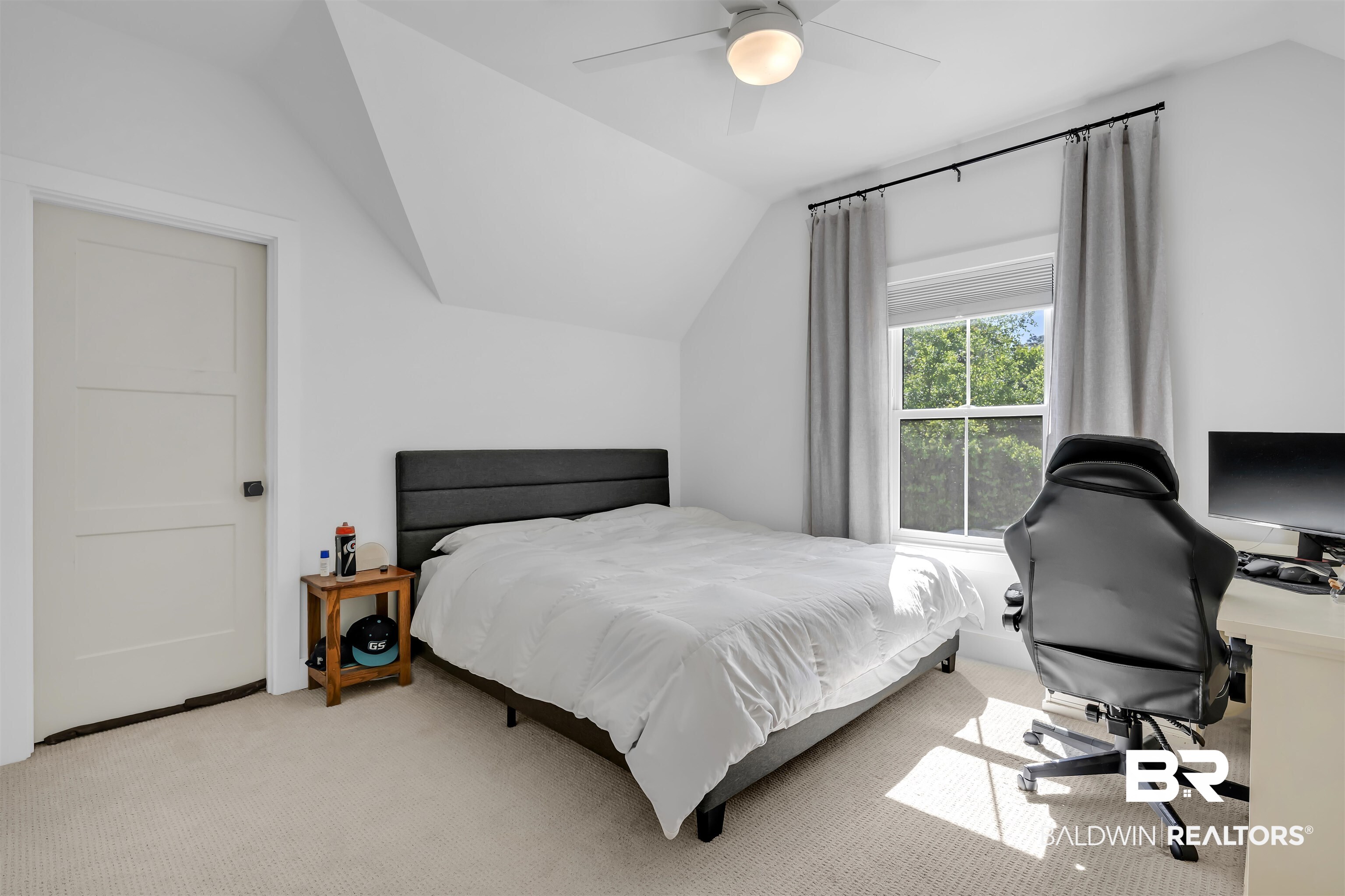 19058 James Road Gulf Shores, AL 36542 - Photo 36 of 49 Bedroom featuring lofted ceiling, light carpet, a ceiling fan, and an office area