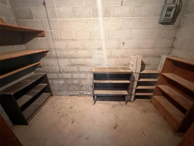a view of room with stairs and wooden floor