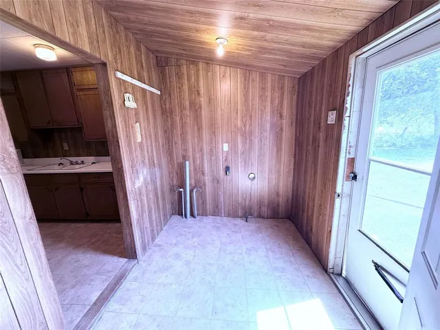 a bathroom with a sink a toilet a mirror and shower