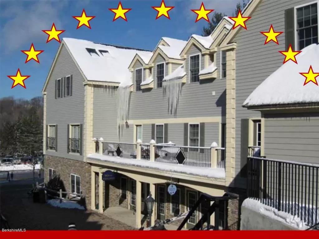a view of a chairs and table in a patio