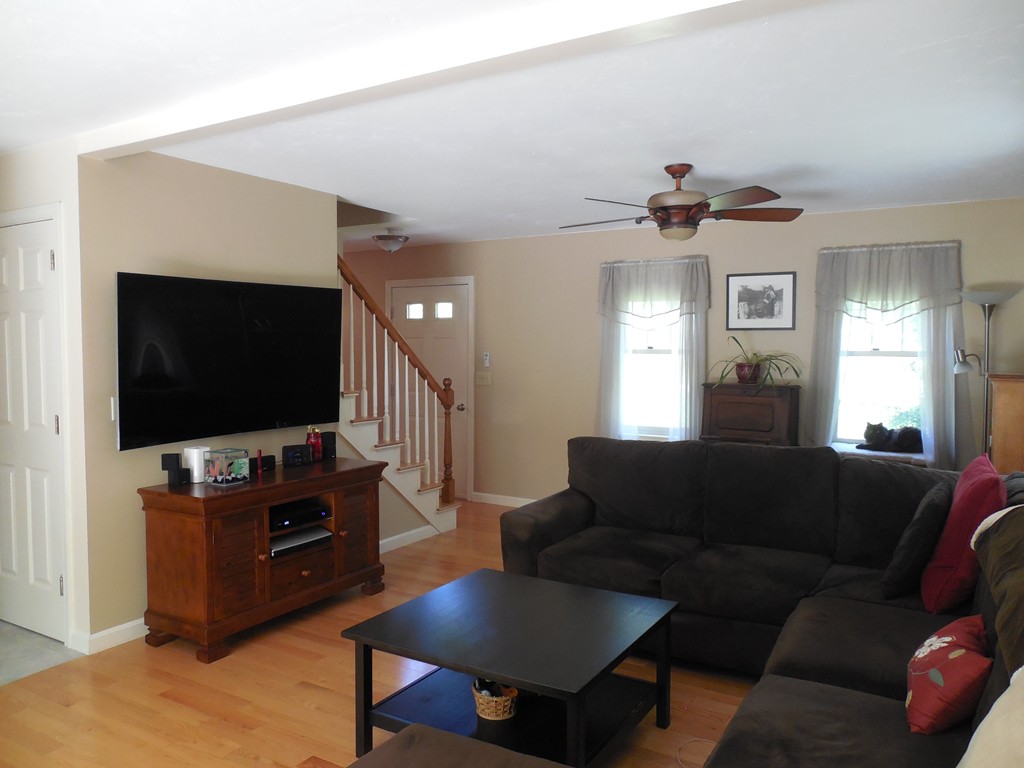27 Stonefence Road Lunenburg, MA 01462 - Photo 7 of 25 a living room with furniture and a flat screen tv