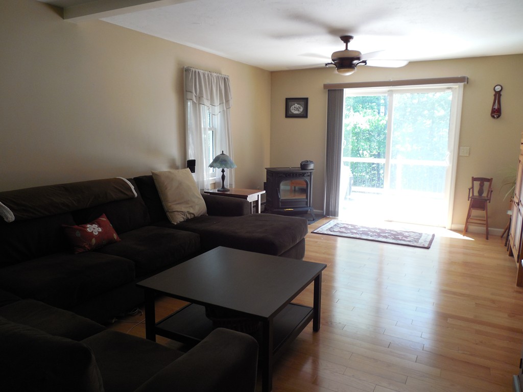 27 Stonefence Road Lunenburg, MA 01462 - Photo 8 of 25 a living room with furniture and a window