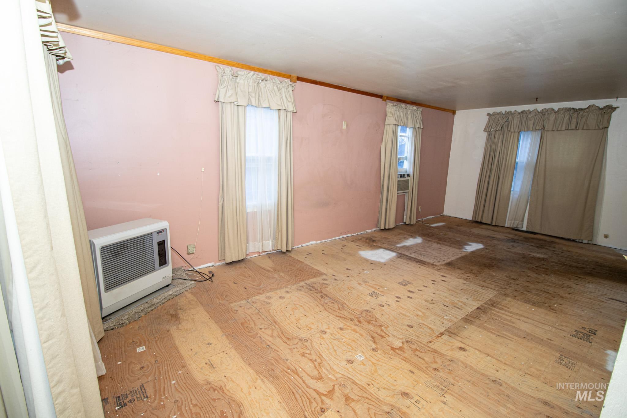 404 Harmony Heights Road Orofino, ID 83544 - Photo 12 of 35 Unfurnished living room featuring wood finished floors