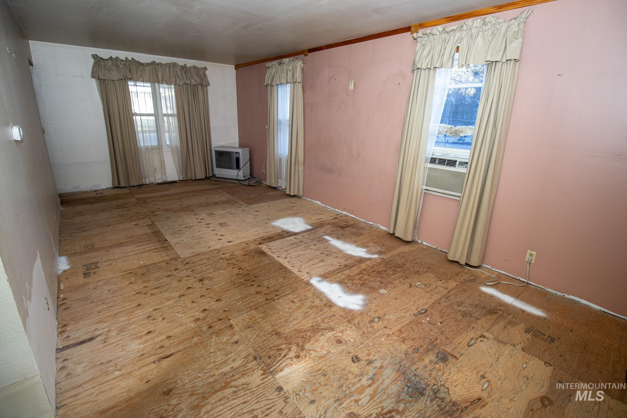 404 Harmony Heights Road Orofino, ID 83544 - Photo 13 of 35 Unfurnished living room featuring heating unit