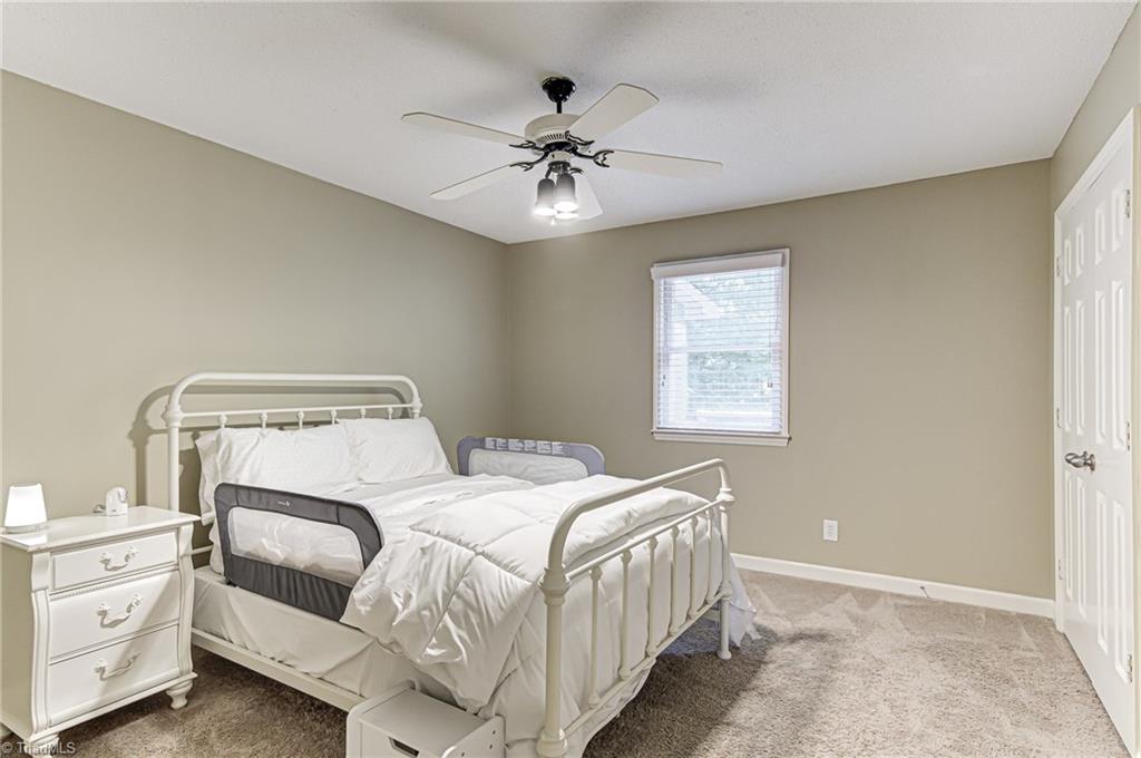 6135 Styers Ferry Road Clemmons, NC 27012 - Photo 15 of 29 Bedroom looks over backyard.