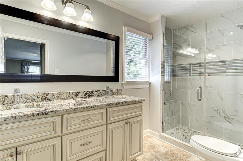 6135 Styers Ferry Road Clemmons, NC 27012 - Photo 19 of 29 Master bathroom with double vanity.