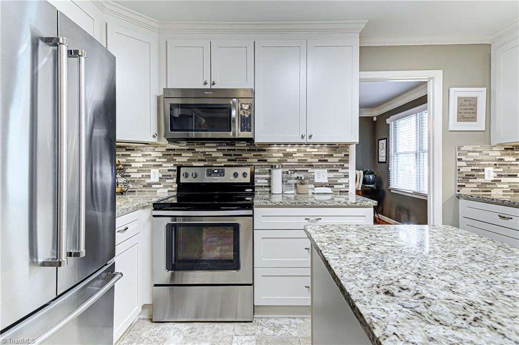 6135 Styers Ferry Road Clemmons, NC 27012 - Photo 7 of 29 Updated kitchen, center island is on wheels