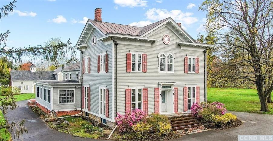 a front view of a house with garden