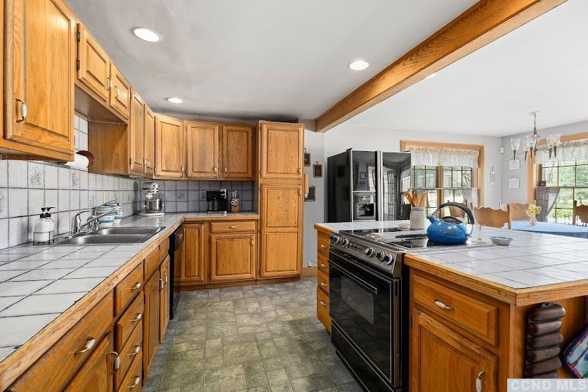 46 Broad Street Kinderhook, NY 12106 - Photo 15 of 44 a kitchen with stainless steel appliances granite countertop a stove a sink and a refrigerator