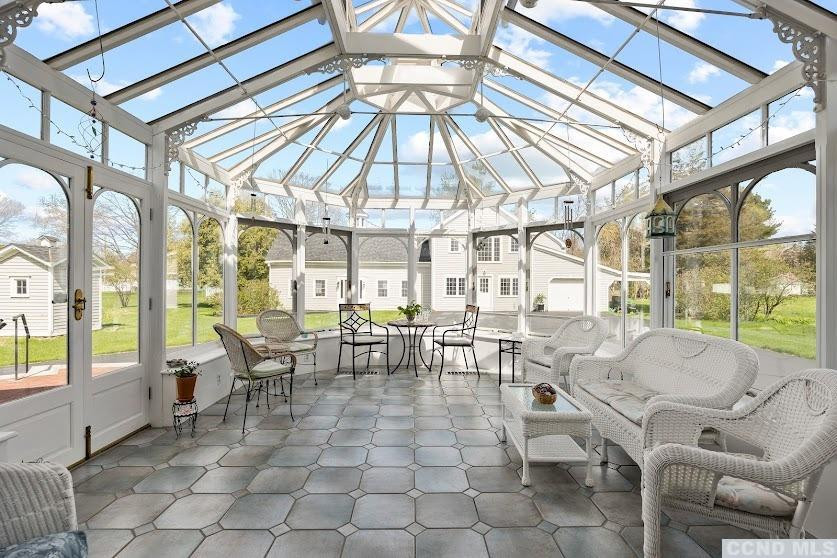 46 Broad Street Kinderhook, NY 12106 - Photo 20 of 44 a view of a dining hall with couches and large umbrella with wooden floor