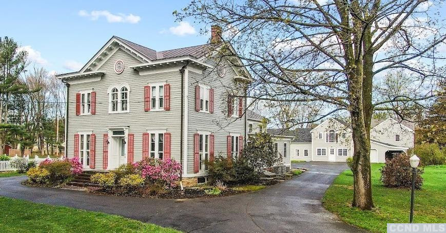 46 Broad Street Kinderhook, NY 12106 - Photo 2 of 44 a front view of a house with garden