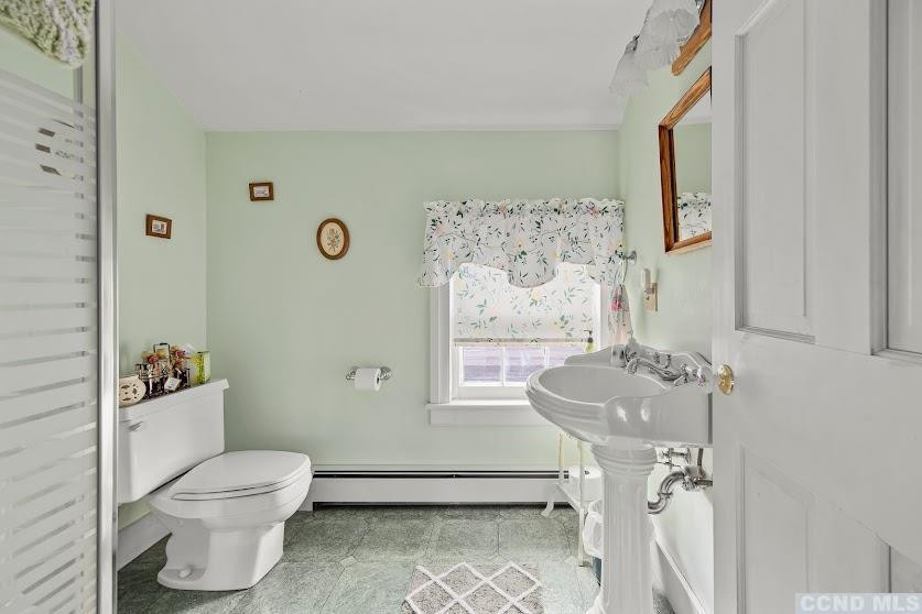 46 Broad Street Kinderhook, NY 12106 - Photo 31 of 44 a bathroom with a toilet sink and mirror