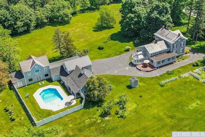 46 Broad Street Kinderhook, NY 12106 - Photo 4 of 44 an aerial view of a house with swimming pool and big yard