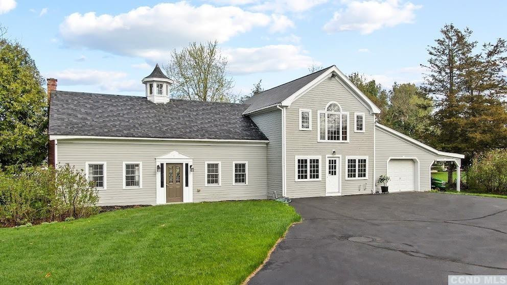 46 Broad Street Kinderhook, NY 12106 - Photo 5 of 44 a view of a yard in front of a house with a large tree