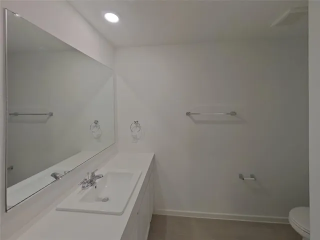 a bathroom with a sink and mirror