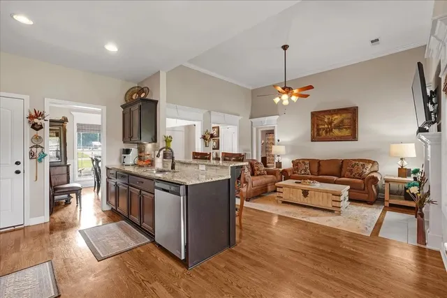 a view of a house with backyard porch and sitting area