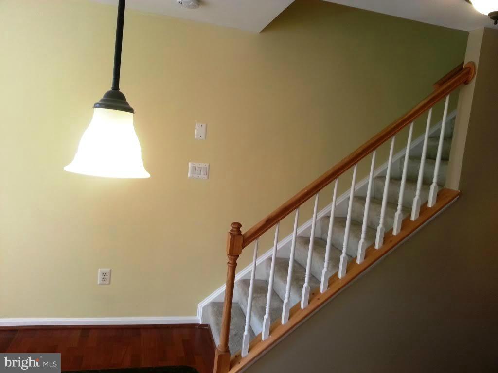 45053 Fellowship Square Ashburn, VA 20147 - Photo 7 of 9 a view of entryway and hall with wooden floor