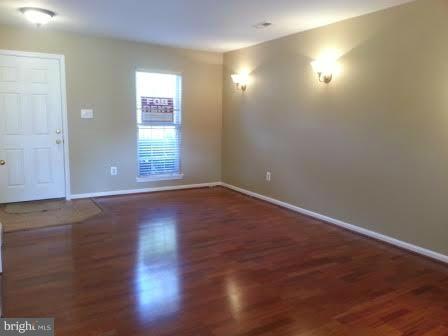 45053 Fellowship Square Ashburn, VA 20147 - Photo 9 of 9 an empty room with wooden floor and windows