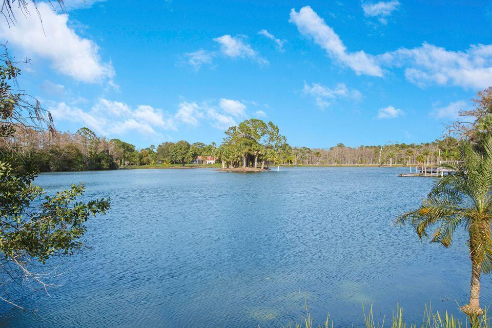 19900 Mack Dairy Road Jupiter, FL 33478 - Photo 11 of 11 a view of a lake with houses in the back